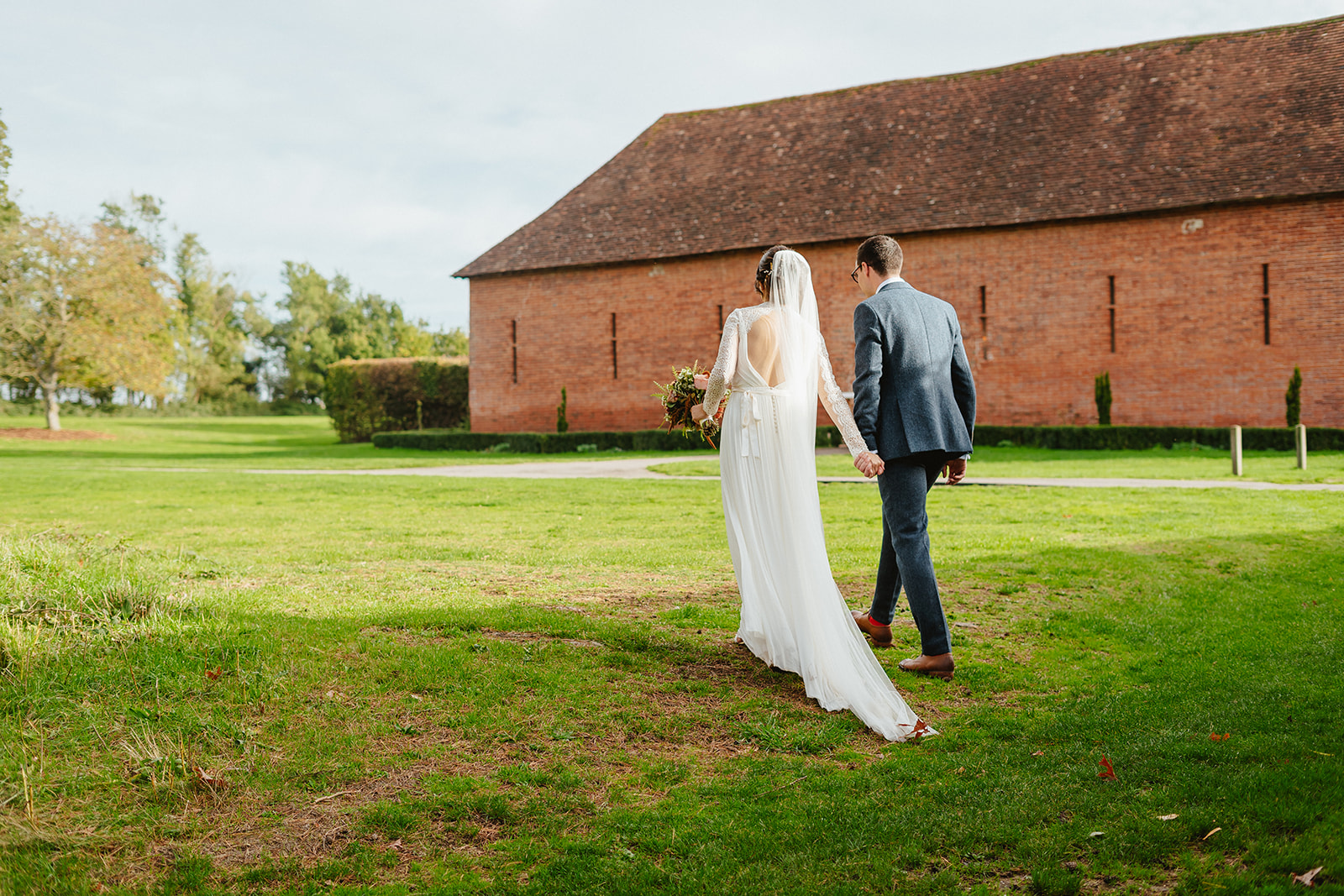 Sarah and Mat Walking Across the grounds at Ufton Court in Berkshire